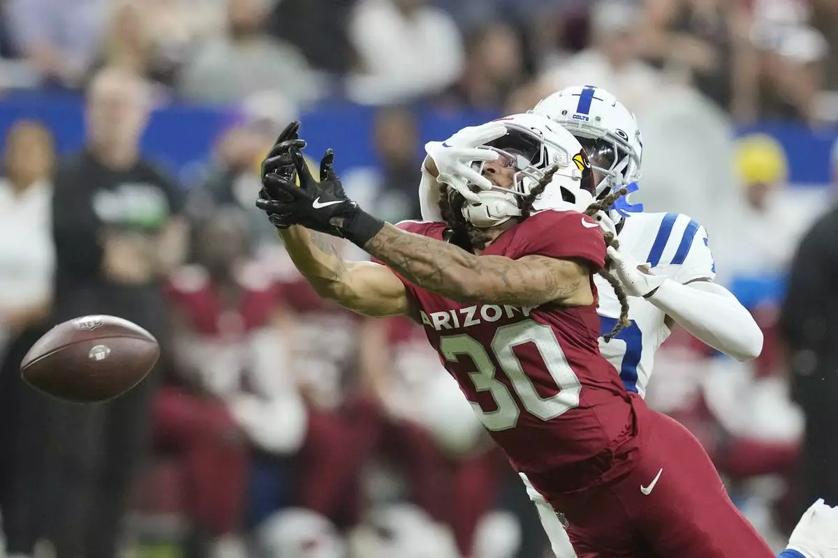 Arizona Cardinals wide receiver Xavier Weaver (30) is unable to make a catch on a pass as Indianapolis Colts cornerback Jaylin Simpson defends during the second half of a preseason NFL football game, Saturday, Aug. 17, 2024, in Indianapolis. (AP Photo/Darron Cummings)