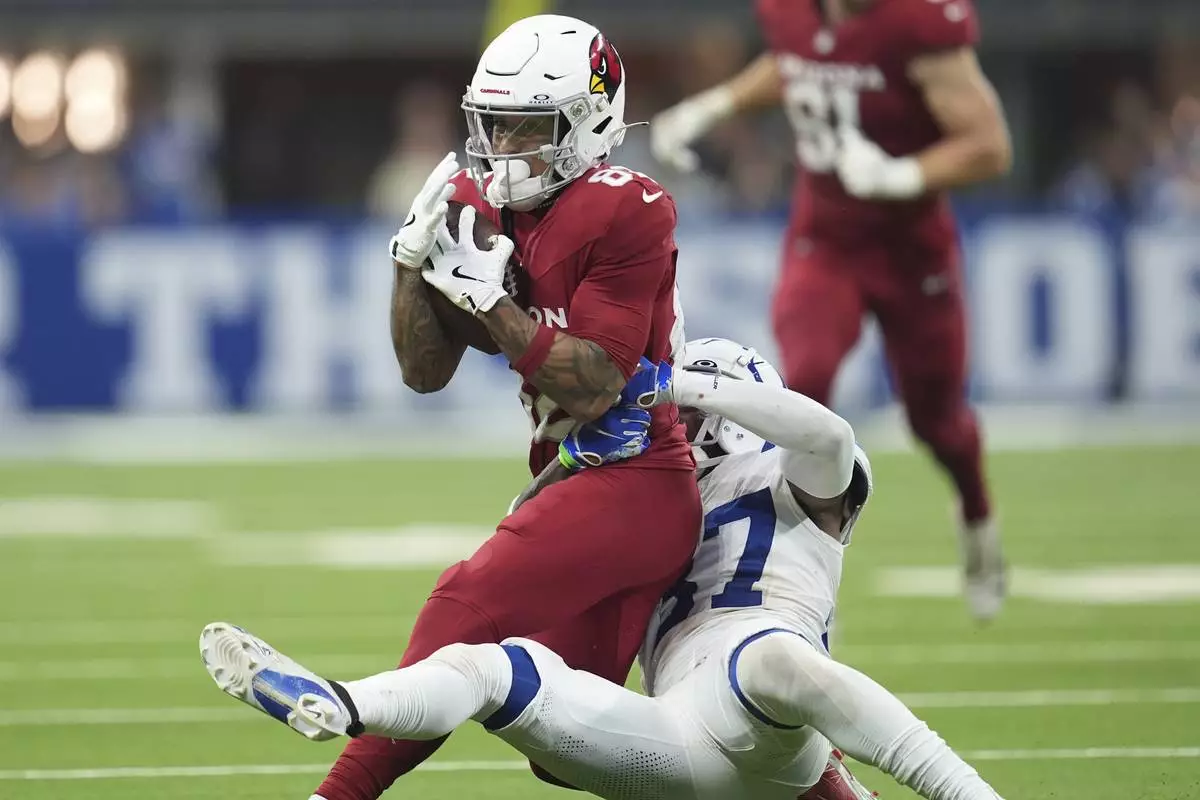 Arizona Cardinals wide receiver Andre Baccellia, left, makes a catch against Indianapolis Colts cornerback Ameer Speed during the first half of a preseason NFL football game, Saturday, Aug. 17, 2024, in Indianapolis. (AP Photo/Michael Conroy)