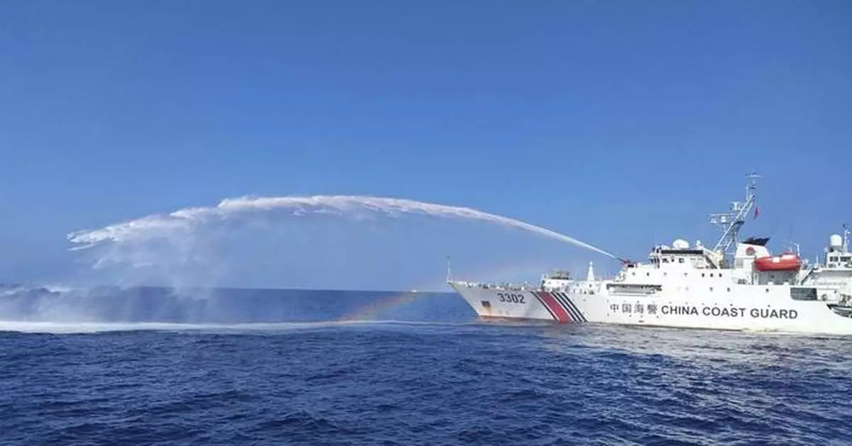 Chinese coast guard ships fire water cannons and block Philippine fisheries vessel in disputed sea