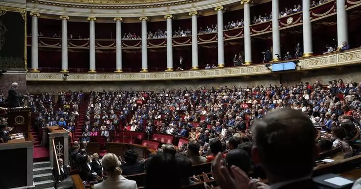 France's Macron holds talks with key political players in a bid to form a new government