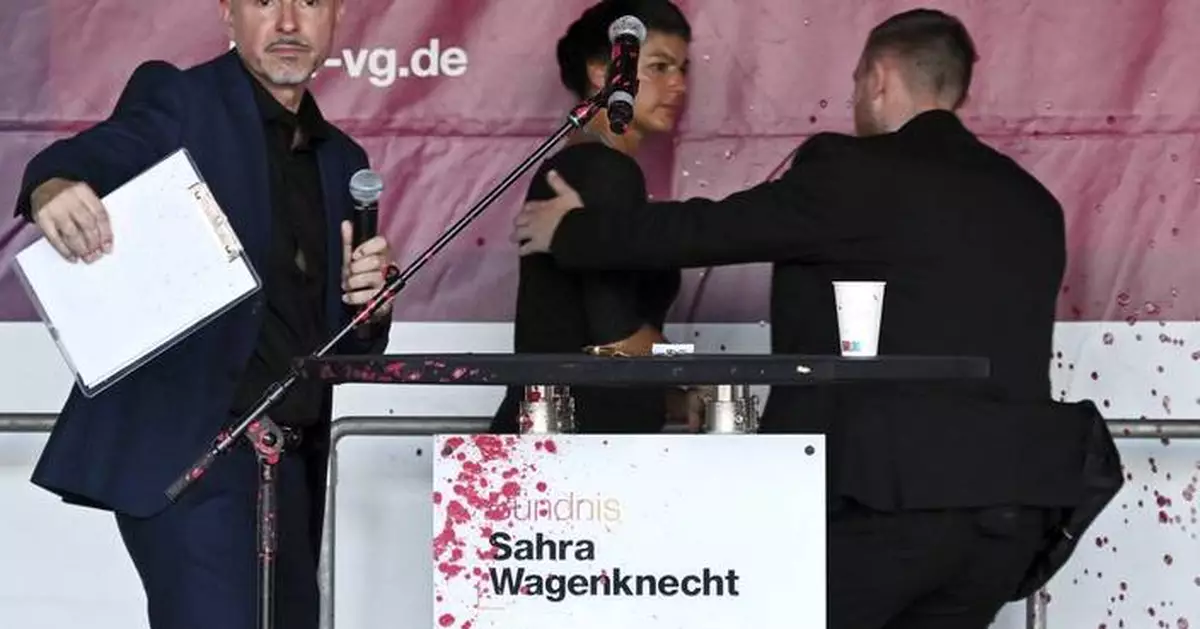 Prominent German leftist politician sprayed with a red liquid, likely paint, during campaign event