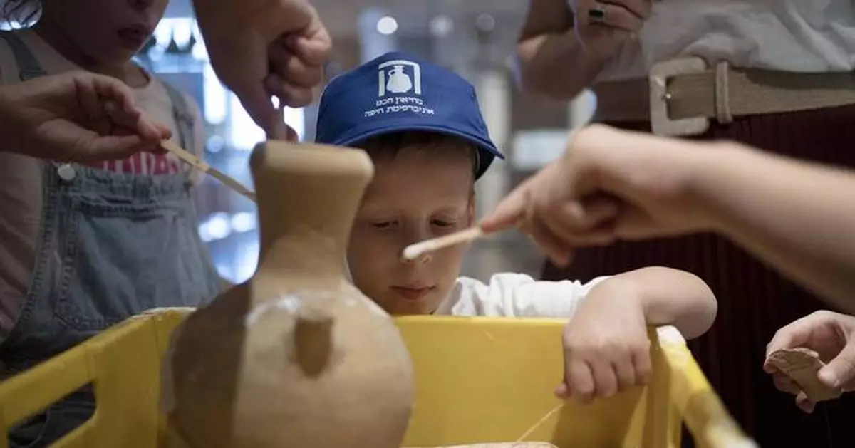 An Israeli boy who broke an ancient jar learns how the museum is piecing it back together