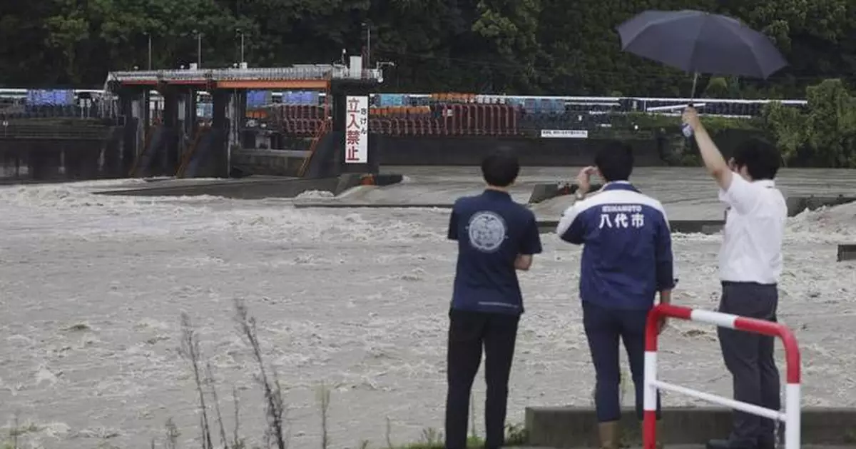 Slow tropical storm dumps heavy rain around Tokyo after causing floods in southern Japan