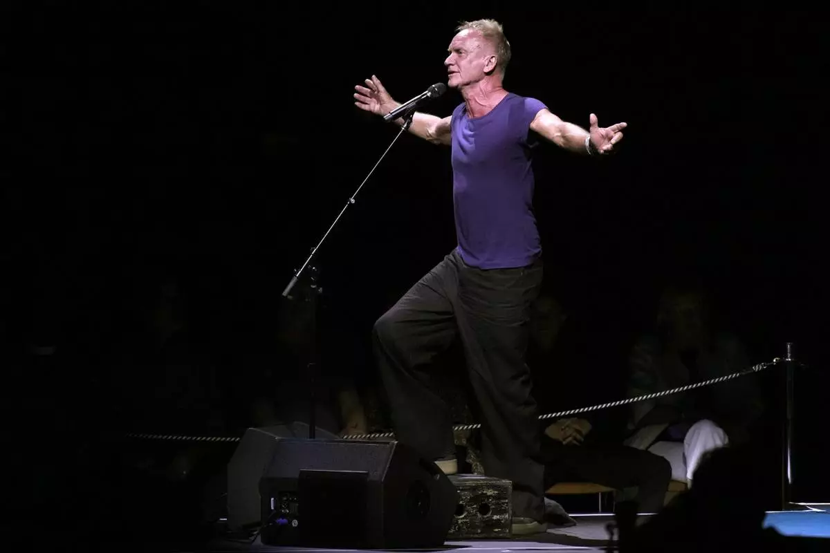 Sting performs in celebration of the 50th anniversary of Philippe Petit's World Trade Center Twin Towers high-wire walk at the Cathedral Church of St. John the Divine on Wednesday, Aug. 7, 2024, in New York. (Photo by Charles Sykes/Invision/AP)