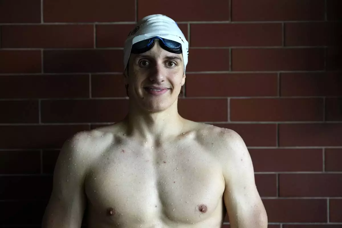David Kratochvil, a teenage swimmer who prepares for the Paralympic Games in Paris, poses for a photo during his training in Tachov, Czech Republic, Wednesday, July 3, 2024. (AP Photo/Petr David Josek)