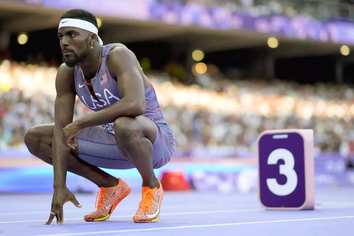 Kenneth Bednarek, of the United States, prepares for a heat in the men's 200-meter at the 2024 Summer Olympics, Monday, Aug. 5, 2024, in Saint-Denis, France. (AP Photo/Bernat Armangue)