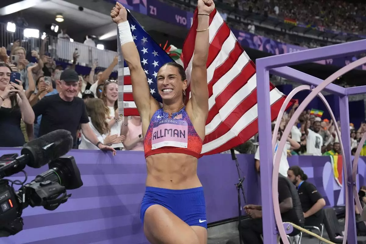Valarie Allman, of the United States, celebrates after winning the women's discus throw final at the 2024 Summer Olympics, Monday, Aug. 5, 2024, in Saint-Denis, France.(AP Photo/Matthias Schrader)