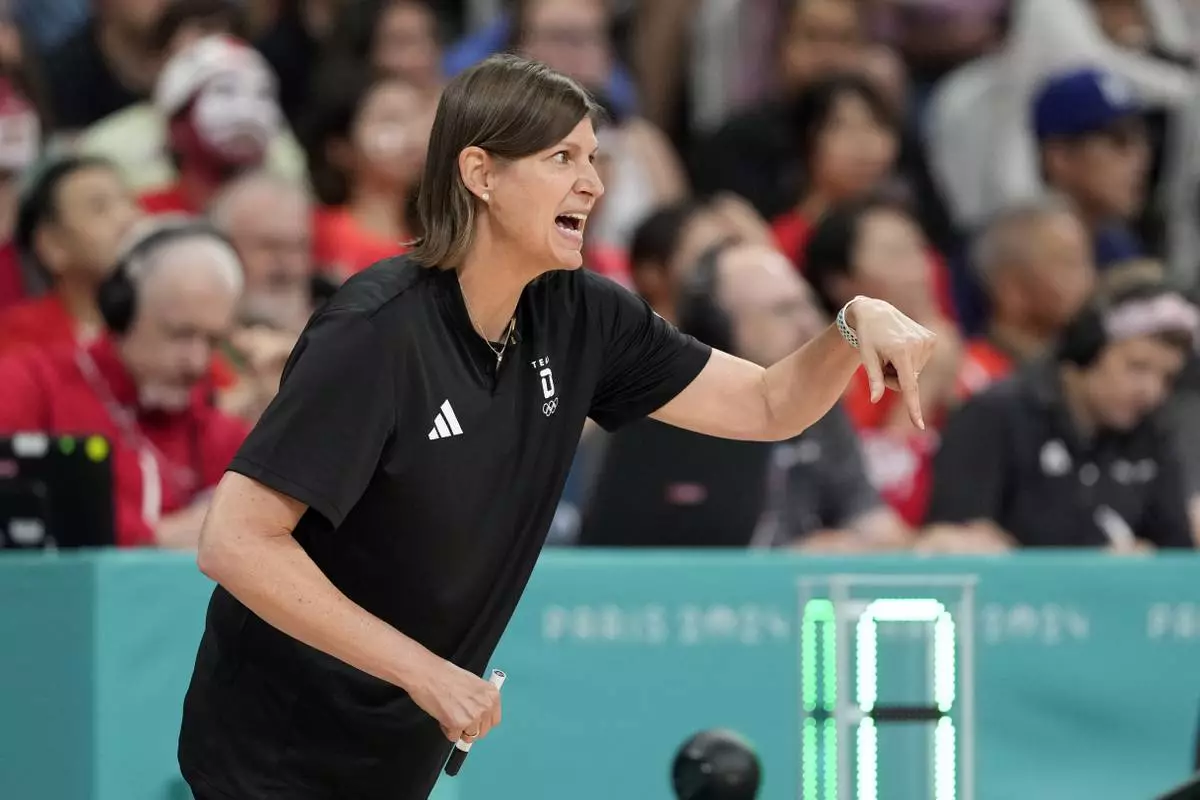Germany head coach Lisa Thomaidis gestures during a women's basketball game at the 2024 Summer Olympics, Thursday, Aug. 1, 2024, in Villeneuve-d'Ascq, France. (AP Photo/Michael Conroy)