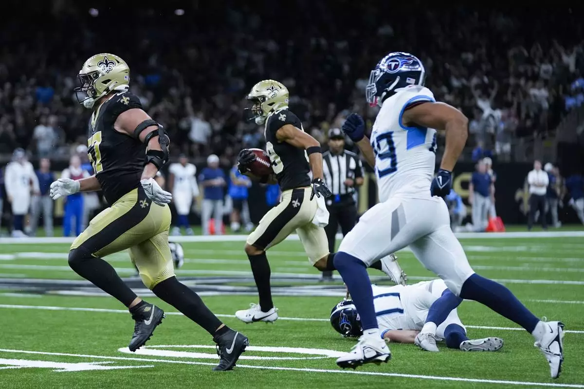 New Orleans Saints wide receiver Samson Nacua (89) returns a missed field goal during the first half of an NFL preseason football game against the Tennessee Titans, Sunday, Aug. 25, 2024, in New Orleans. (AP Photo/Gerald Herbert)