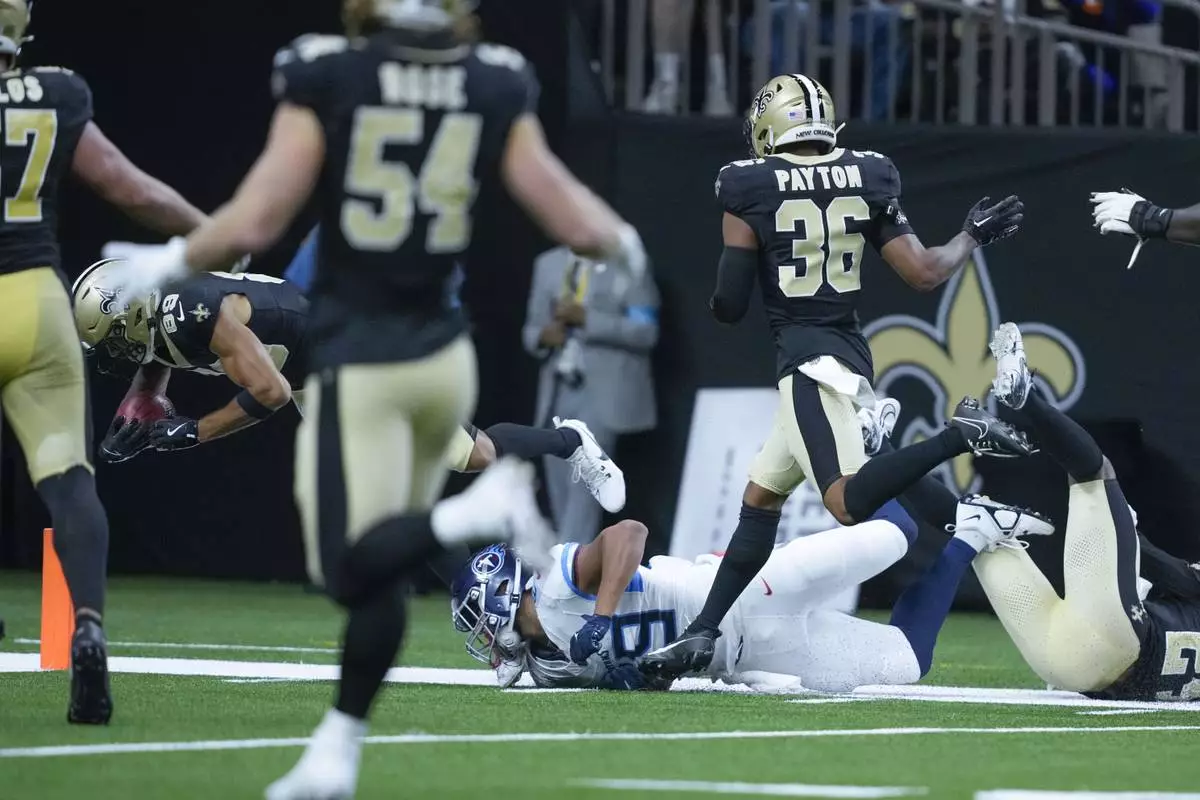 New Orleans Saints wide receiver Samson Nacua (89) is ejected from the field near the goal line as he returns a failed field goal during the first half of an NFL preseason game against the Tennessee Titans, Sunday, Aug. 25, 2024, in New Orleans. (AP Photo/Gerald Herbert)