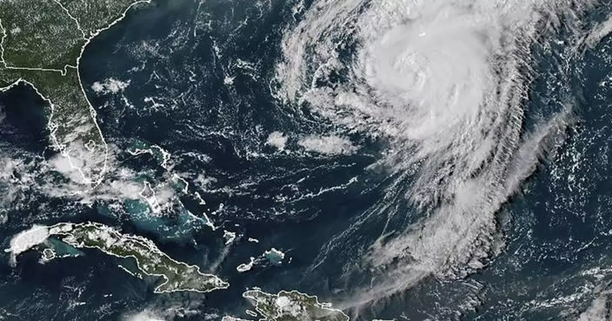 Hurricane Ernesto weakens into tropical storm as it moves away from Bermuda over open waters