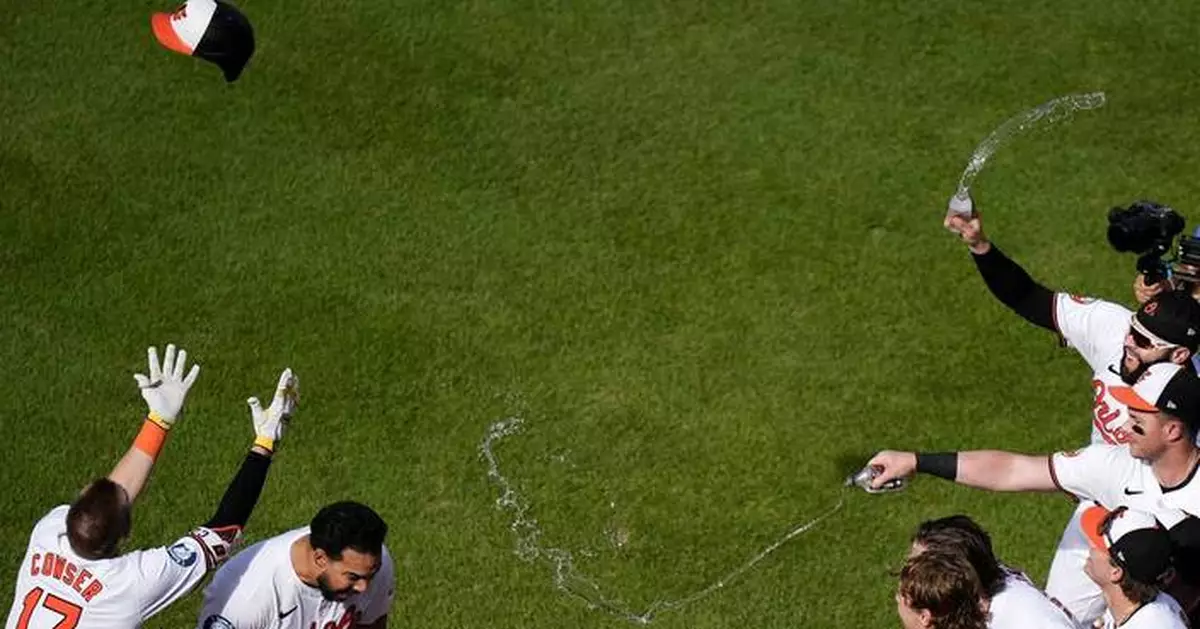 An AP photographer catches an Orioles celebration from high above the action