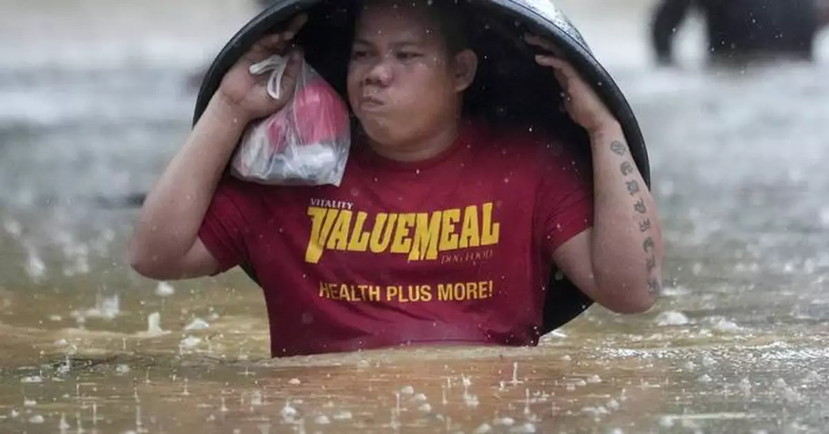 Fierce storm blows out of northern Philippines after leaving 14 dead in landslides and floods