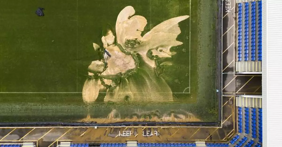 Soccer pitch collapses as parts of the UK are hit by flash floods