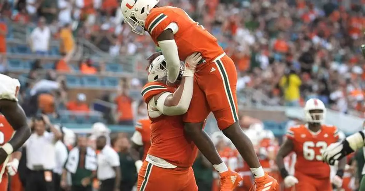 Cam Ward passes for 3 TDs, runs for another and No. 12 Miami rolls past Florida A&amp;M, 56-9