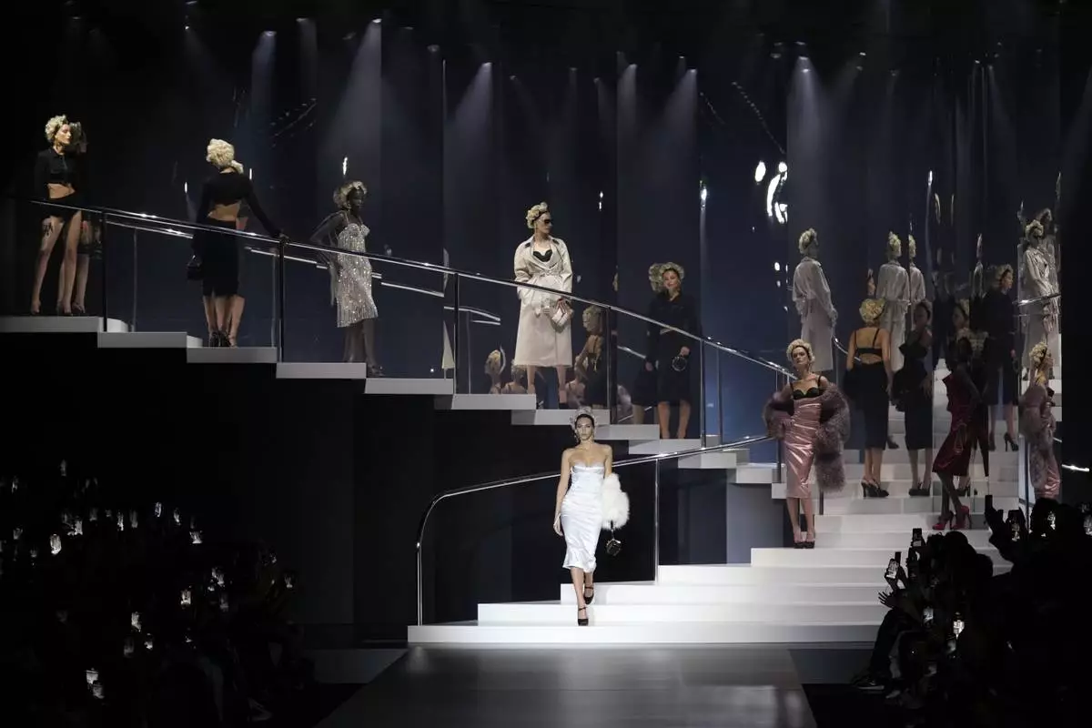 Models wear creations as part of the Dolce &amp; Gabbana Spring Summer 2025 collection, that was presented in Milan, Italy, Saturday, Sept. 21, 2024. (AP Photo/Antonio Calanni)