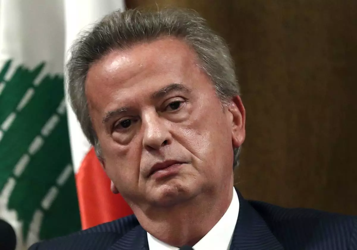 FILE - Riad Salameh the governor of Lebanon's Central Bank, listens to a journalist's question during a press conference, in Beirut, on Nov. 11, 2019. (AP Photo/Hussein Malla, File)