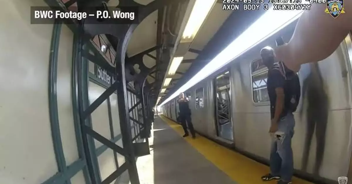 Footage shows NYPD officers firing at man with knife in subway shooting that wounded 4