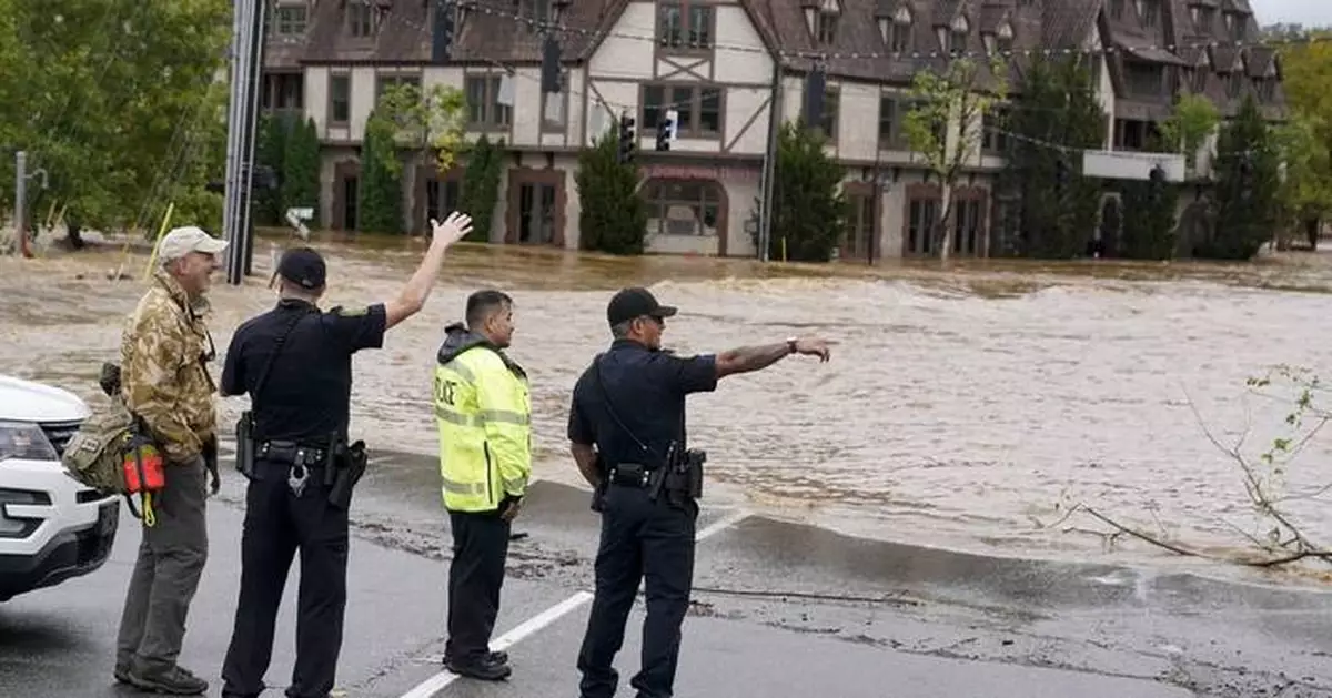 Torrential rains flood North Carolina mountains and create risk of dam failure