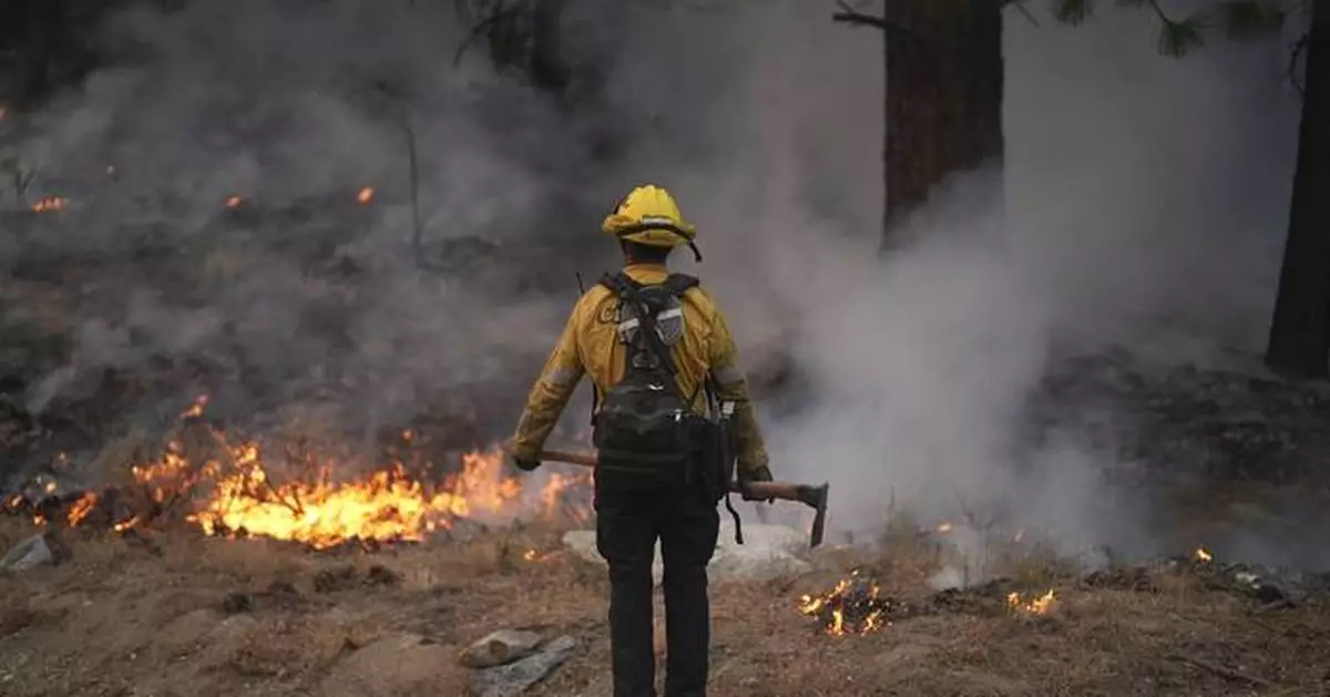 A scenic California mountain town walloped by a blizzard is now threatened by wildfire