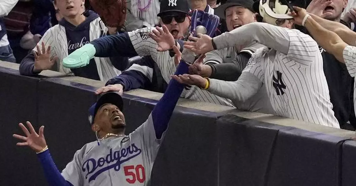 Yankee Stadium fans ejected after one pries ball out of Mookie Betts' glove at World Series