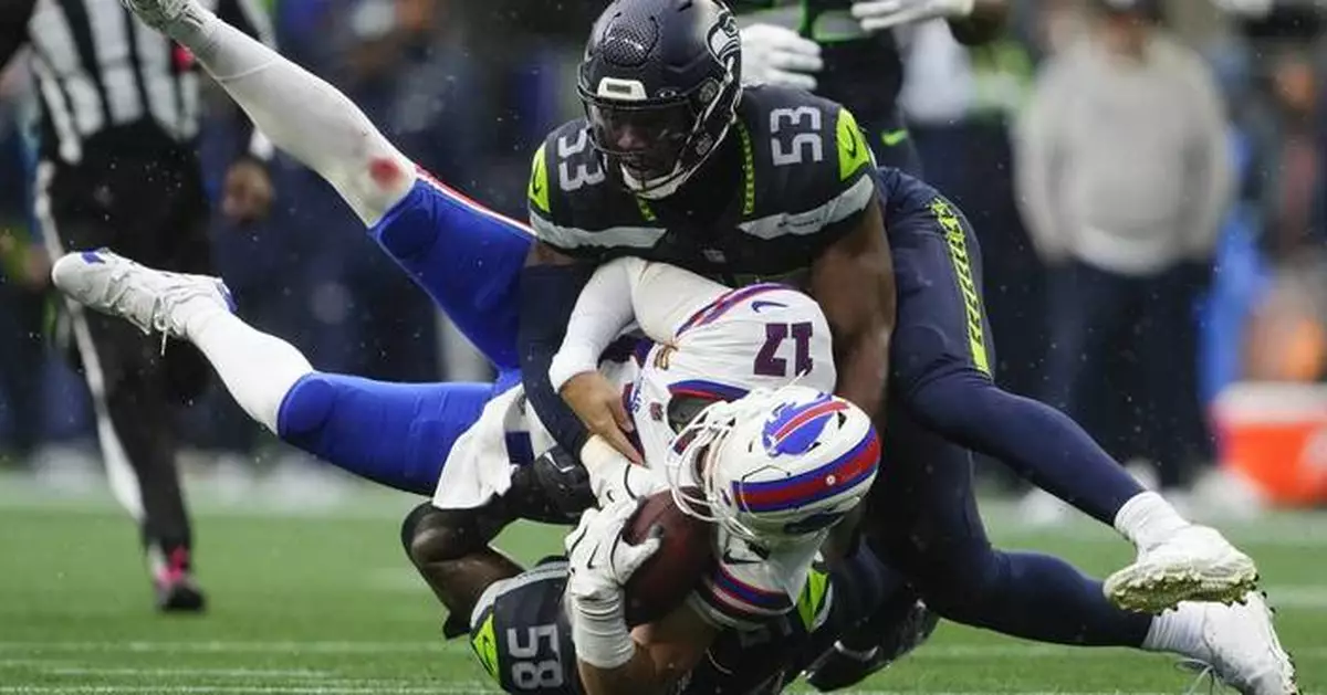 Seahawks teammates Derick Hall and Jarran Reed separated on sideline during loss to Bills