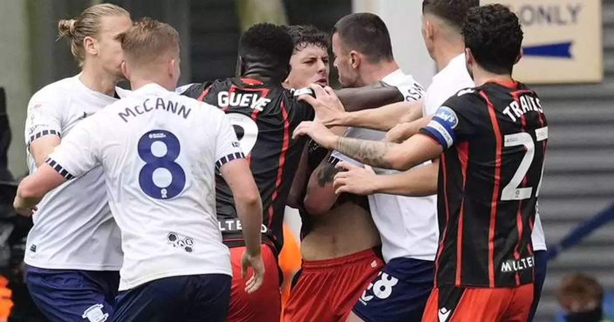 Soccer player in England's second division suspended for biting opponent during ill-tempered game