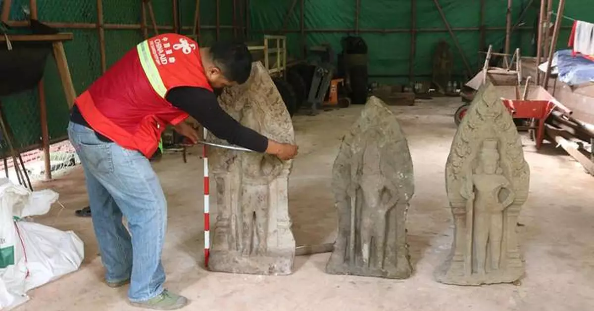 Cambodian archaeologists discover a dozen centuries-old sandstone statues at Angkor UNESCO site