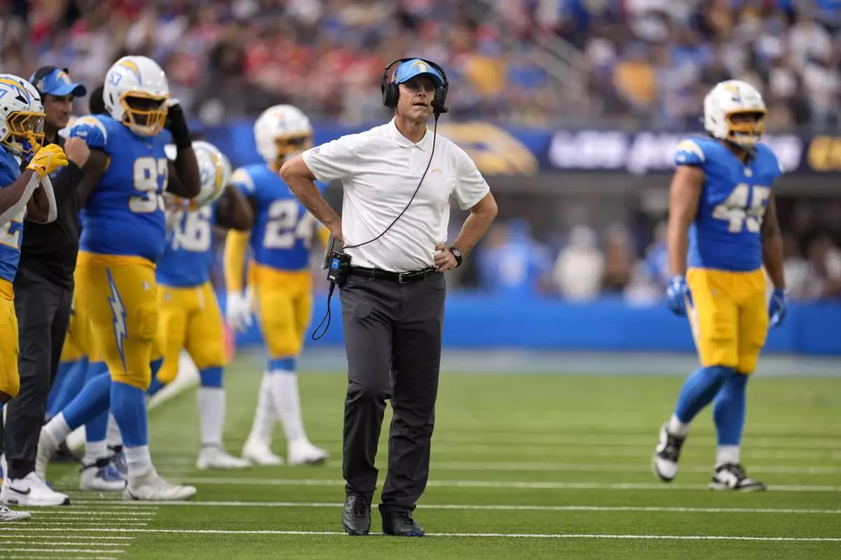 Los Angeles Chargers head coach Jim Harbaugh watches during the second half of an NFL football game against the Kansas City Chiefs Sunday, Sept. 29, 2024, in Inglewood, Calif. (AP Photo/Marcio Jose Sanchez)