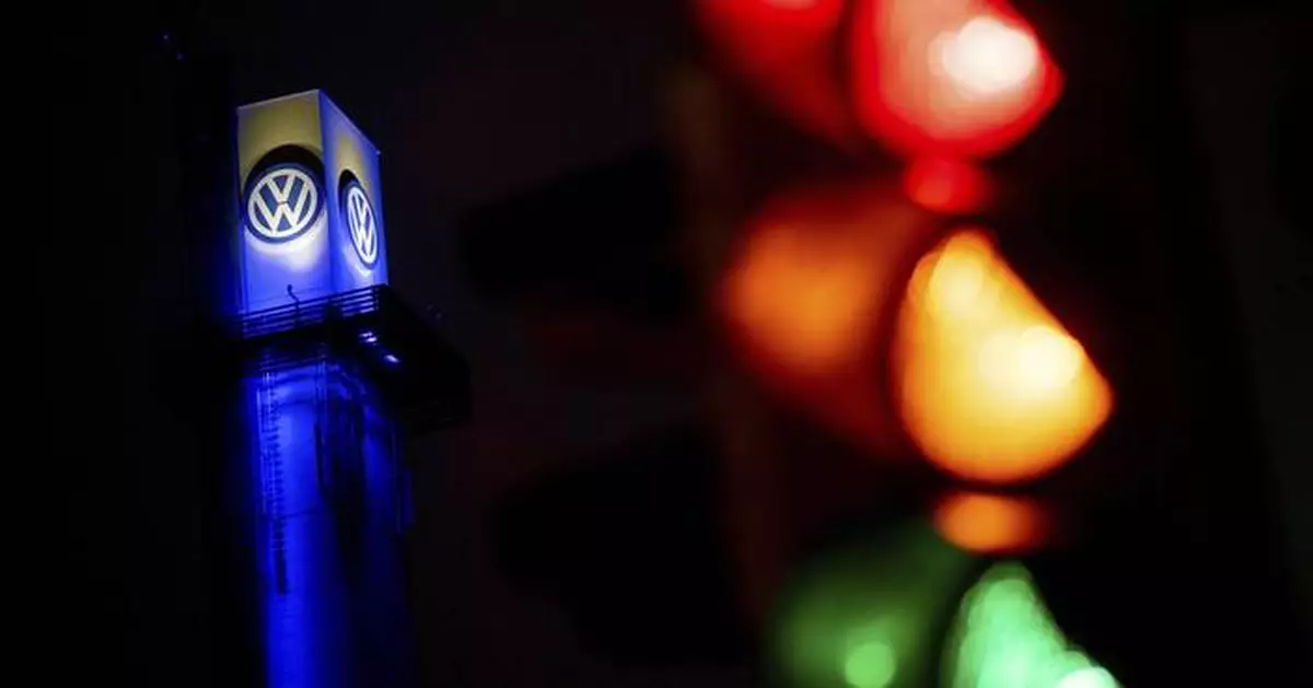 Volkswagen says cost cuts are urgently needed as its earnings decline sharply