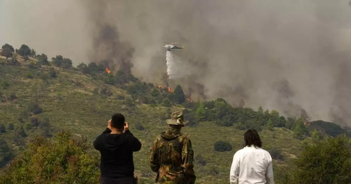 Hundreds of firefighters battle a deadly forest fire raging in southern Greece for the third day