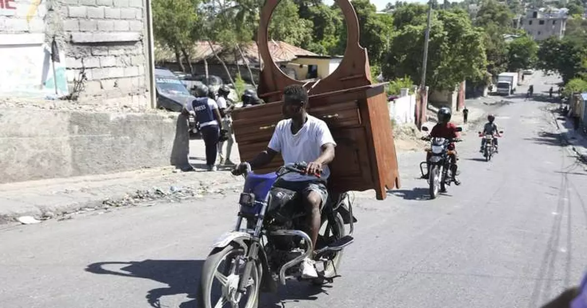 Gang coalition in Haiti spreads violence to Port-au-Prince neighborhood, setting fire to homes
