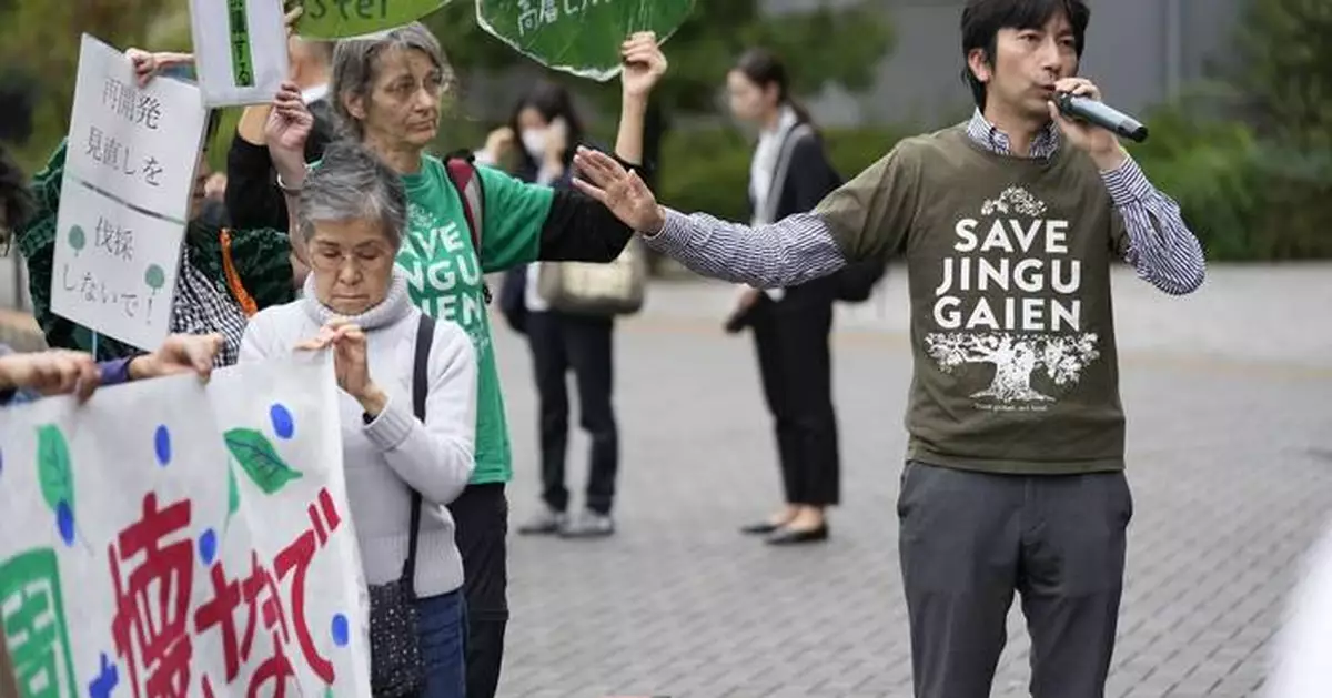 Developers begin cutting trees in a Tokyo park that environmentalists want to protect