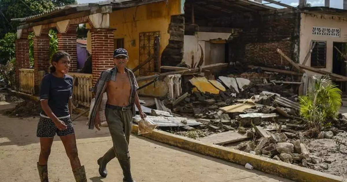 Along Mexico's Pacific coast, flooding from Hurricane John left devastated towns and 17 dead