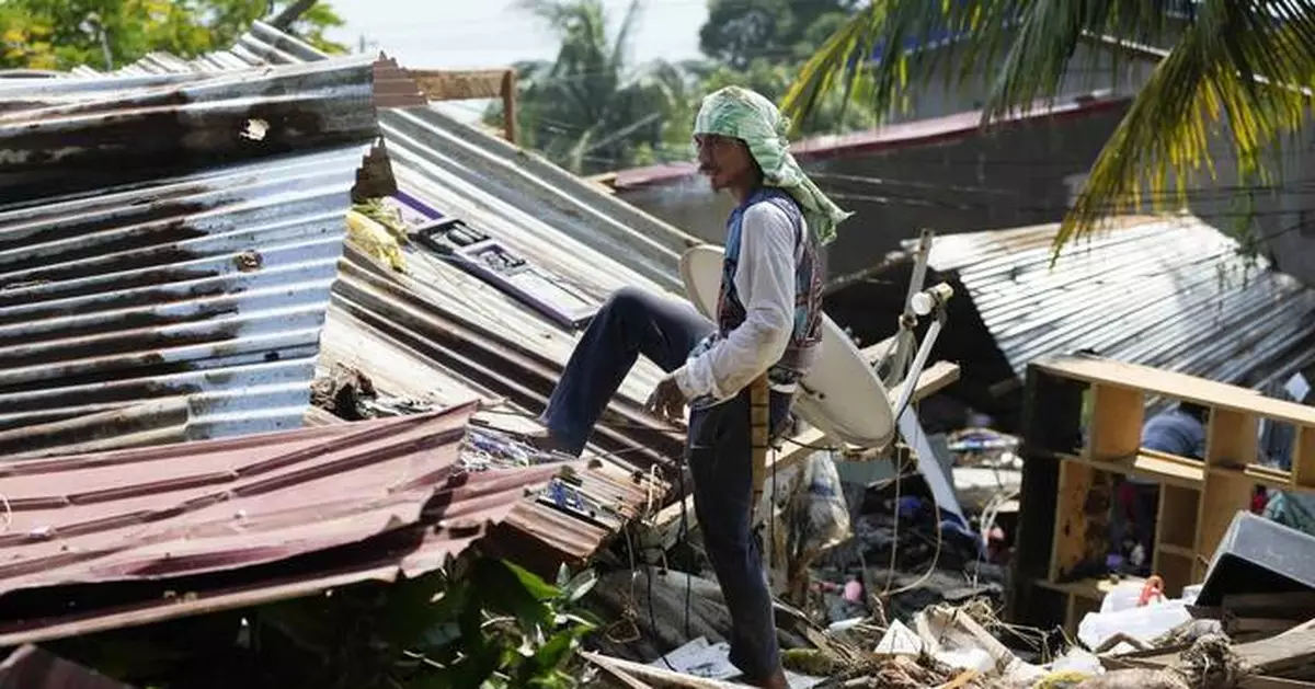 A powerful typhoon nears the Philippines, with many shelters still crammed after a recent storm