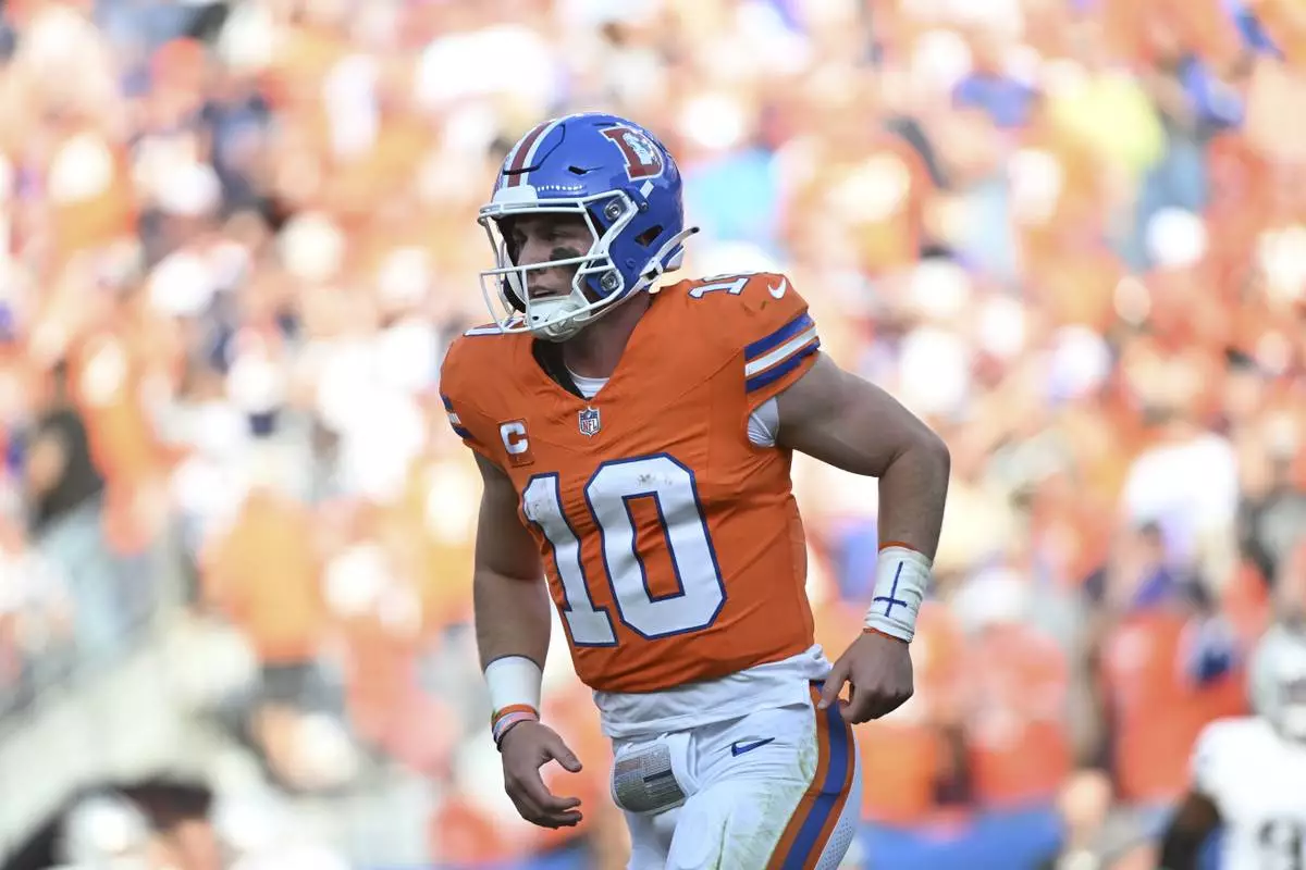 Denver Broncos quarterback Bo Nix runs to the sideline during the second half of an NFL football game against the Las Vegas Raiders, Sunday, Oct. 6, 2024, in Denver. (AP Photo/Geneva Heffernan)