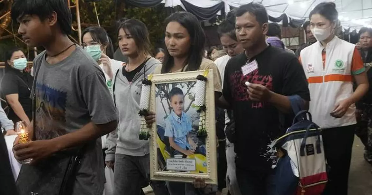 Memories and prayers are shared at small-town funeral for the victims of horrific Thai bus fire