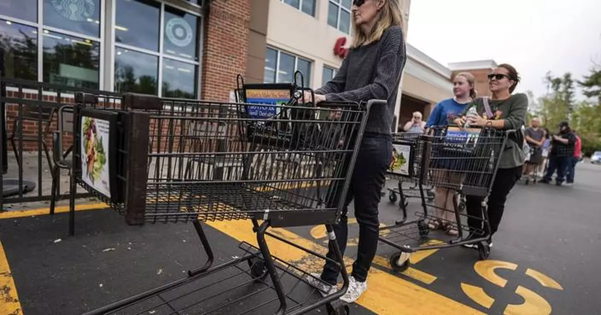 The Latest: Residents line up for food and water in storm-battered North Carolina mountains