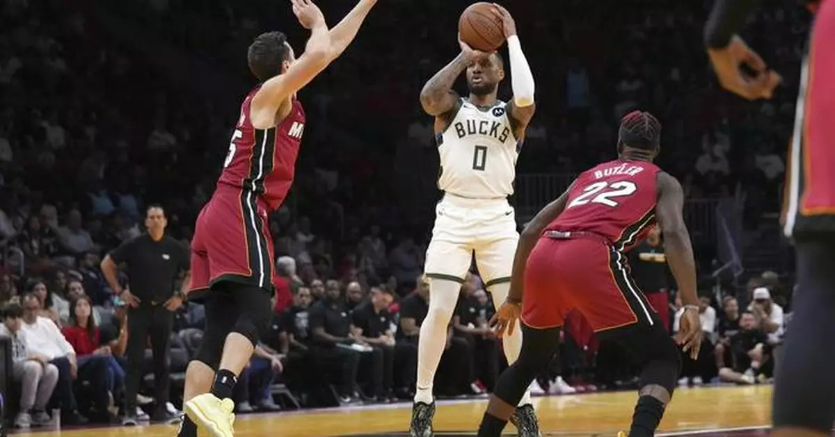 Lillard scores 37 points and Giannis-less Bucks hold off Heat 106-103 to move to 3-0 in Cup play