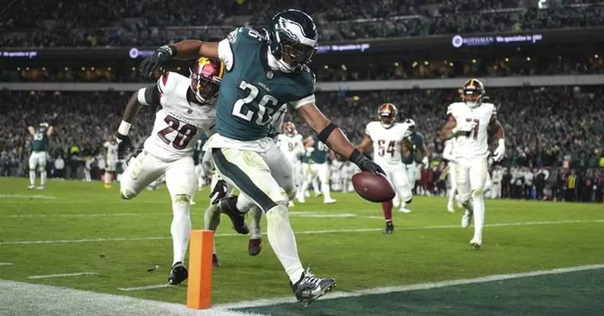 Saquon Barkley runs for 2 TDs, Eagles beat Commanders 26-18 to stretch NFC East lead