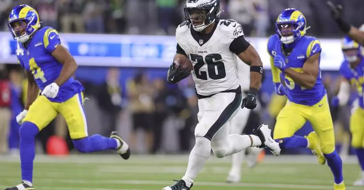 Saquon Barkley sets Eagles franchise record with 255 yards rushing, 2 TDs in a 37-20 win over Rams