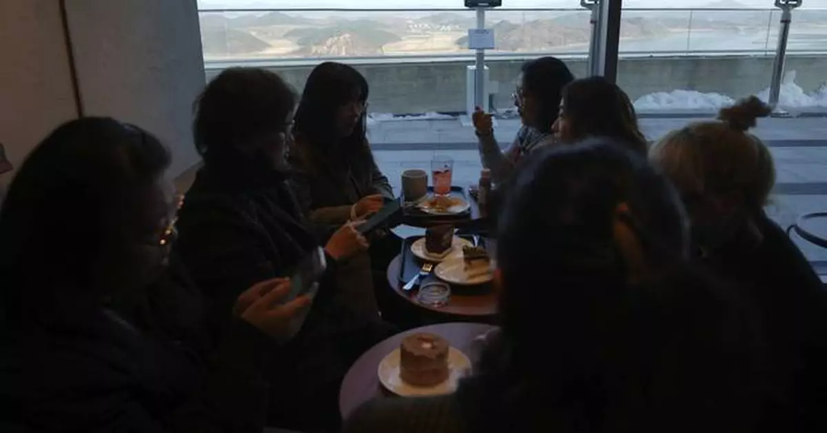 Customers at this Starbucks can sip coffee and observe a quiet North Korean village