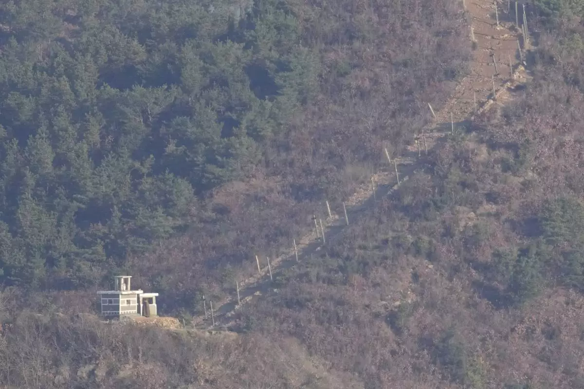 A North Korean soldier stands at a North Korean military guard post, seen from Gimpo, South Korea, Friday, Nov. 29, 2024. (AP Photo/Lee Jin-man)
