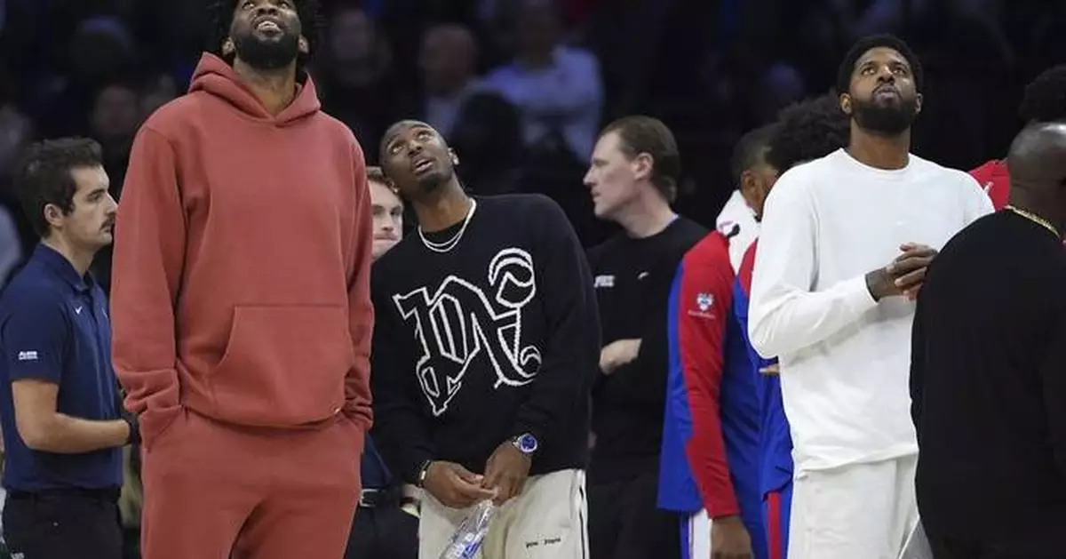 Injured Joel Embiid, Paul George watch from the 76ers' bench once again