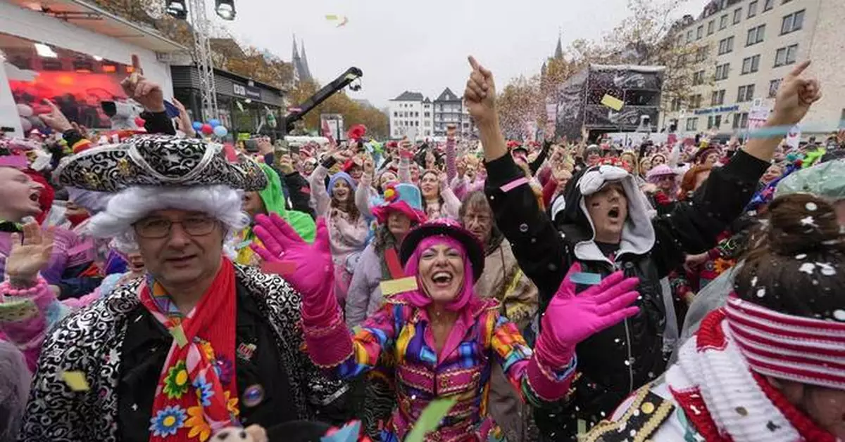 AP PHOTOS: Revelers in costumes take to the streets of Germany to kick off carnival celebrations