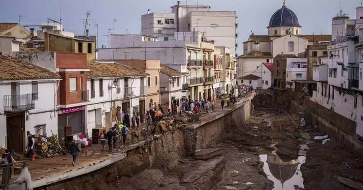 Crashing waves in a hilltop village, a night of terror from Spain's floods