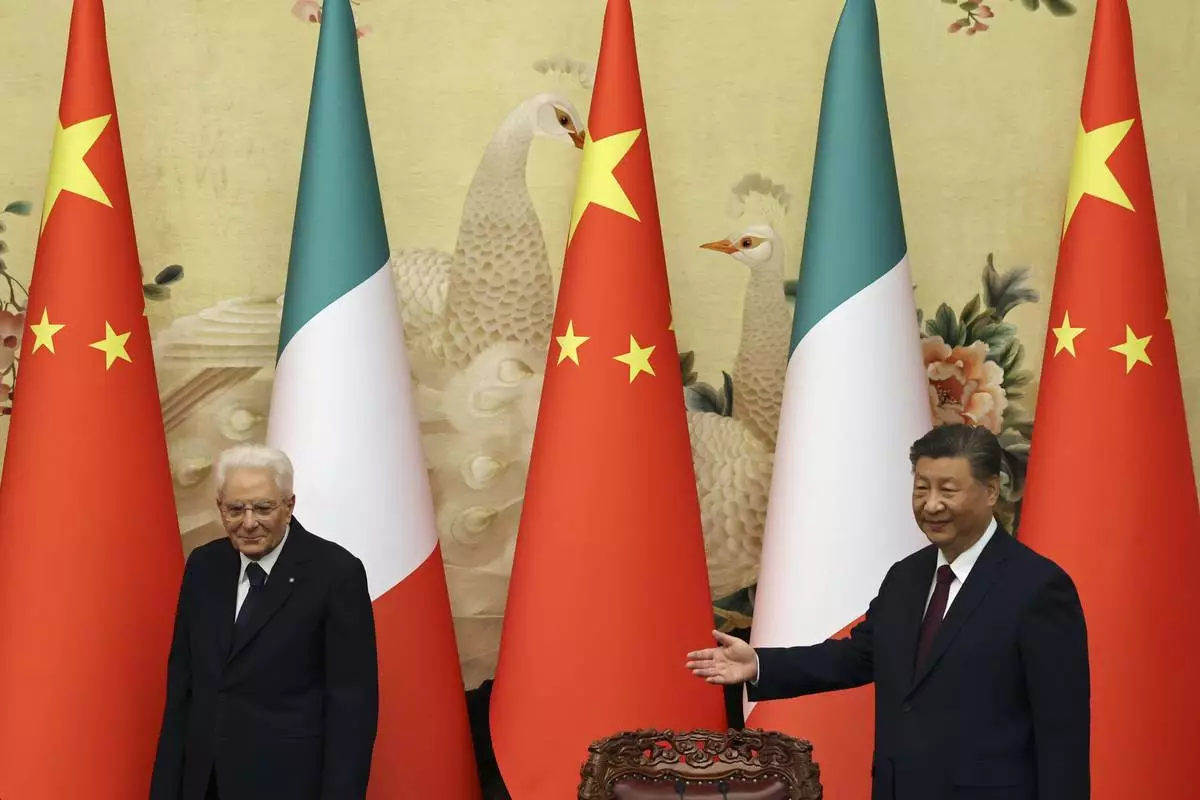 Chinese President Xi Jinping, right, and Italian President Sergio Mattarella arrive for a signing ceremony at the Great Hall of the People in Beijing, Friday, Nov. 8, 2024. (Florence Lo/Pool Photo via AP)