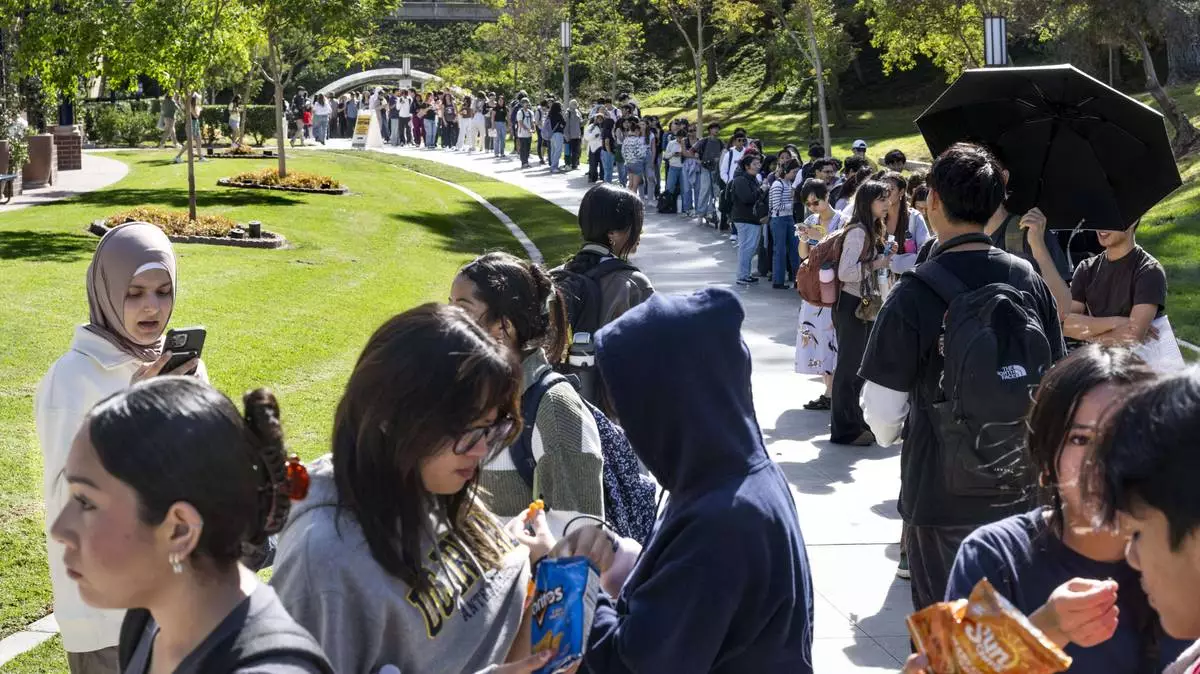 Students wait in line to vote at the student center at the University of California, Irvine on Election Day in Irvine, Calif., Tuesday, Nov. 5, 2024. (Paul Bersebach/The Orange County Register via AP)