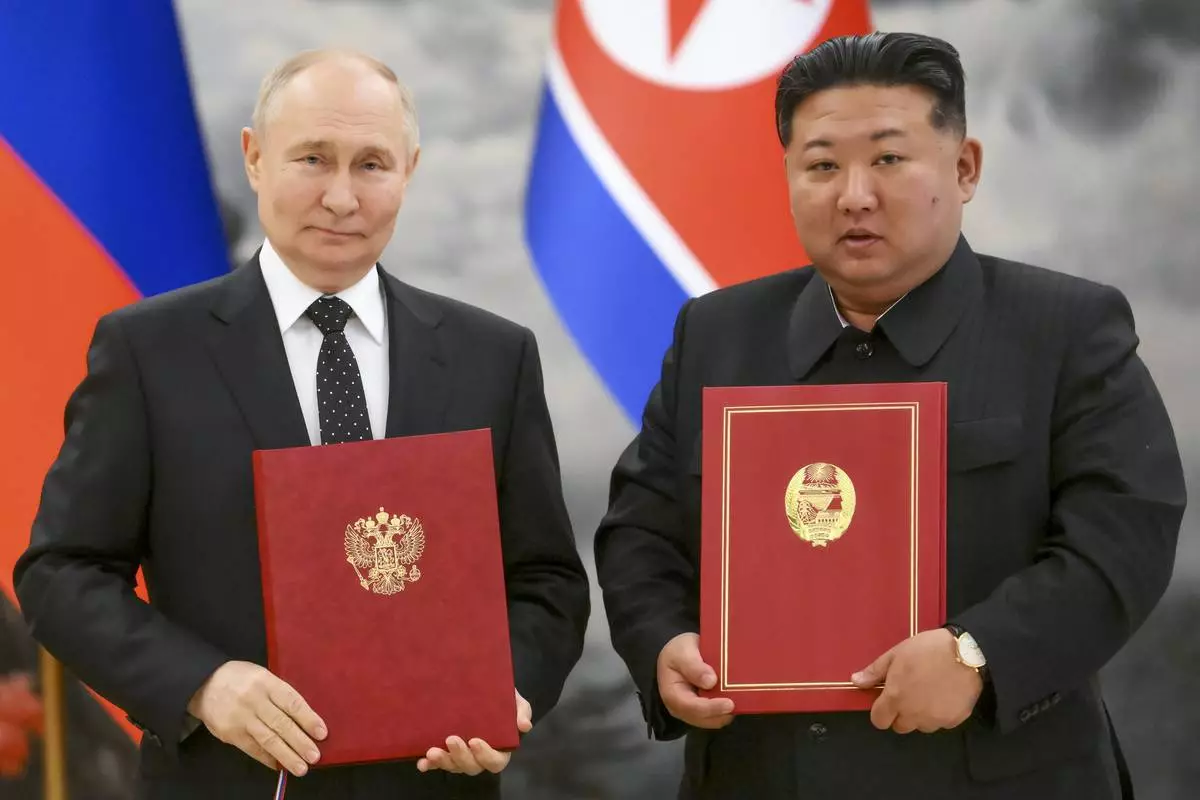 FILE - Russian President Vladimir Putin, left, and North Korea's leader Kim Jong Un pose for a photo during a signing ceremony of the new partnership in Pyongyang, North Korea, on June 19, 2024. (Kristina Kormilitsyna, Sputnik, Kremlin Pool Photo via AP, File)