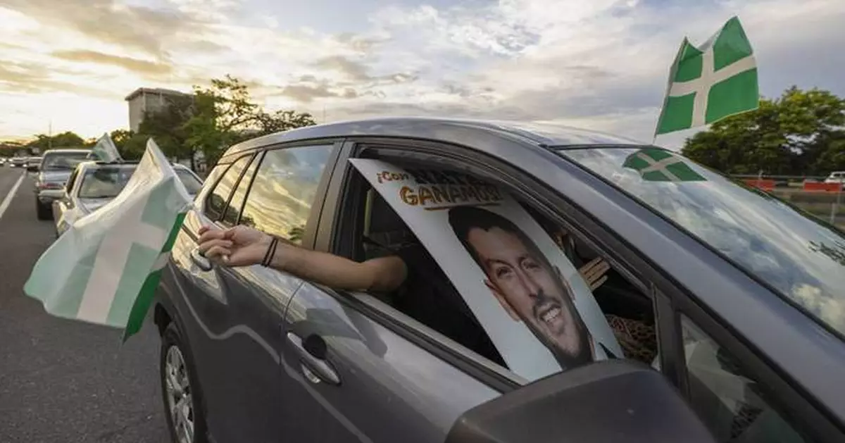 Puerto Ricans brave rain and long lines to vote in a general election that promises to be historic